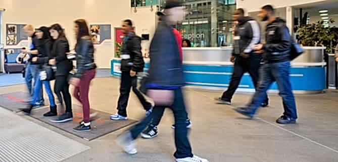 People whizz passed in a blur at a college event