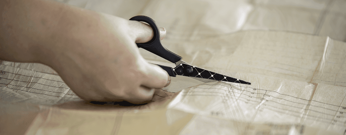 Student cutting with scissors