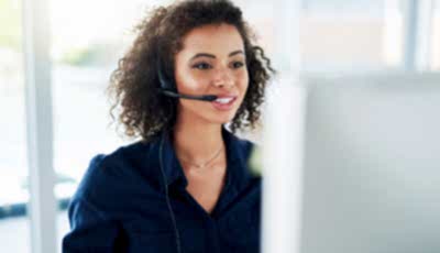 Person speaking at computer