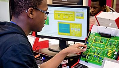 Student working on a circuit board