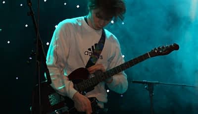 Student playing guitar