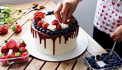 Student decorating a cake