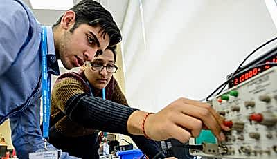 Students operating electrical equipment