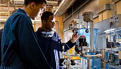 Students operating machinery