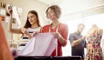 students cutting fabric