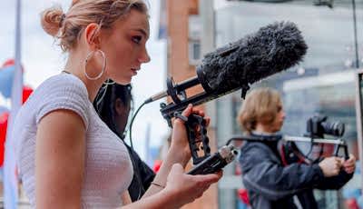 Student operating a microphone