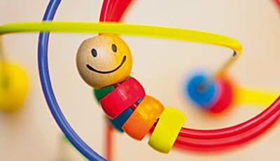 Student feeding a practice baby