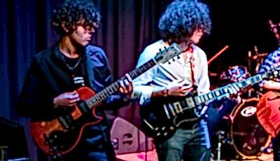 Students playing guitar